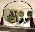 A large orignal Italian 1960s oval brass framed mirror