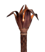 An unusual palm tree floor lamp with real palm trunk, wooden base and wooden shaped leaves