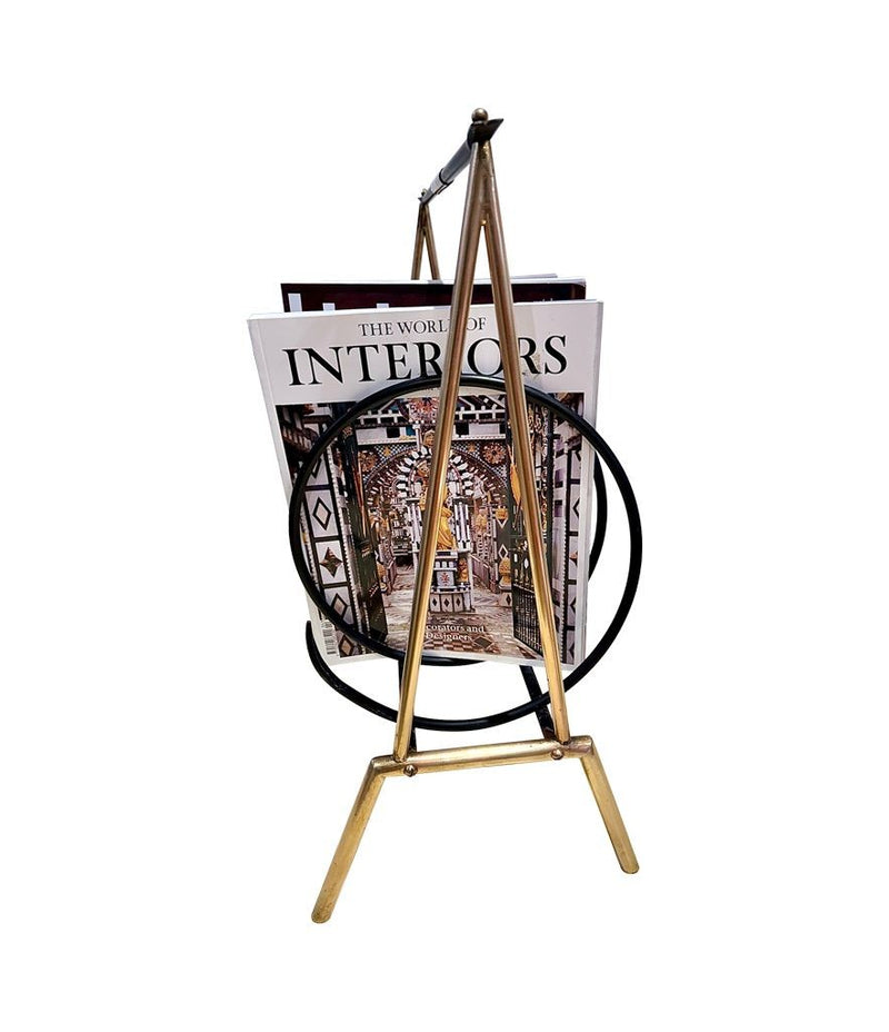 An unusual Italian 1950s mid century brass and black lacquered spiral magazine rack