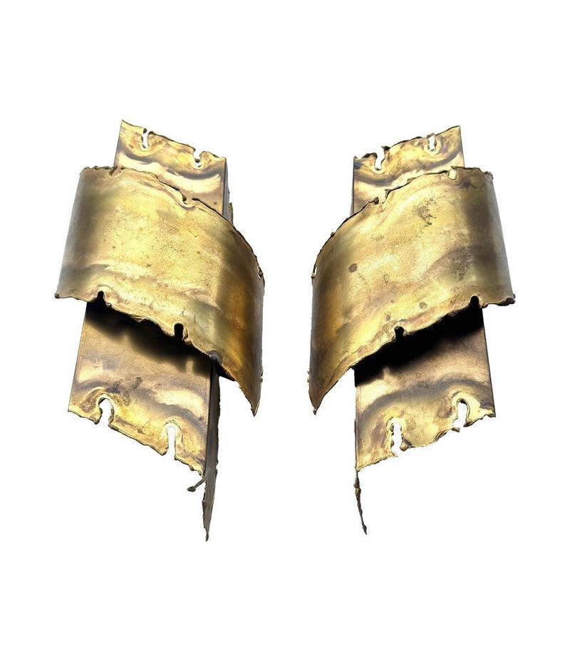 A pair of Danish 1960s torch cut brass wall sconces by Holm Sorensen.