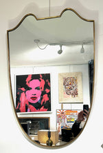 An orignal Italian 1950s shield mirror with orignal mirror plate