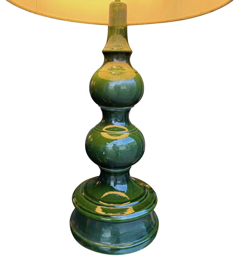 A large French 1960s green glazed ceramic lamp with original hessian shade