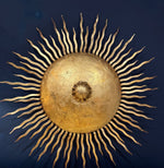 A pair of large 1950s Spanish sunburst wrought iron wall sconces
