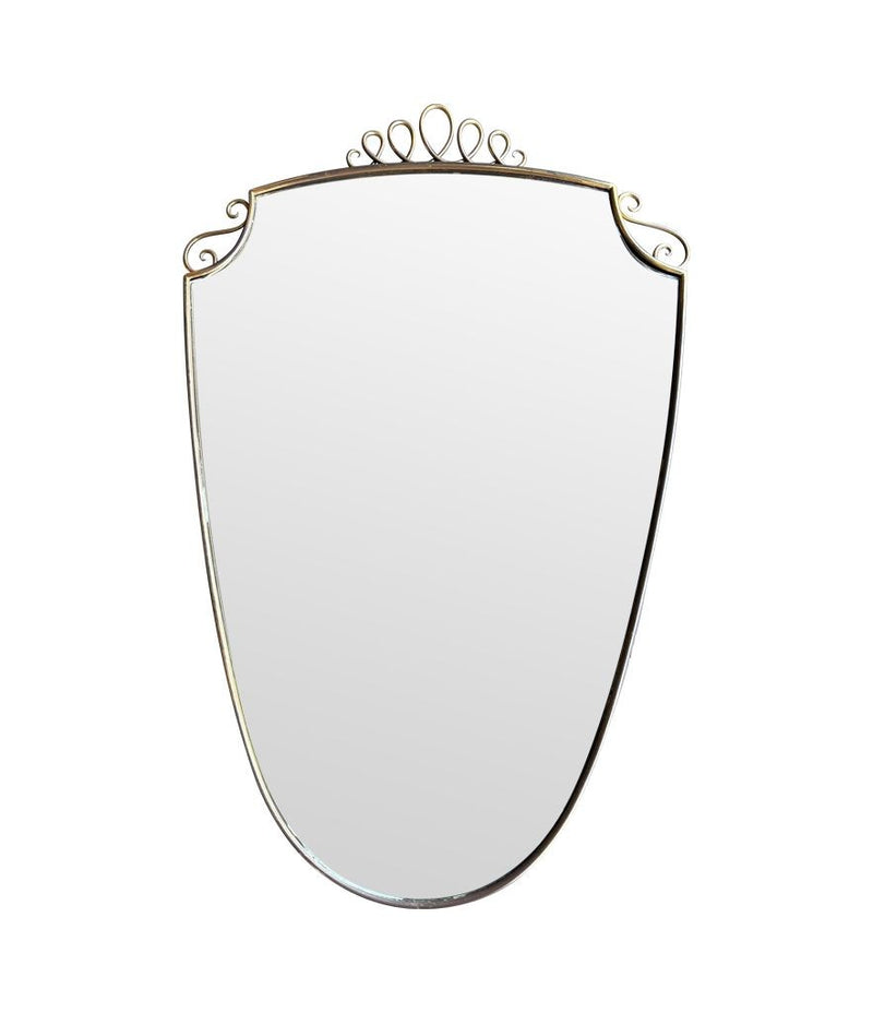 An orignal pair of 1950s Gio Ponti style Italian portrait brass framed mirror with brass top scroll detailing