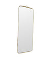 Mid century brass framed mirror with slim profile and scroll top detail