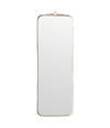 Mid century brass framed mirror with slim profile and scroll top detail