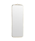 Mid century brass framed mirror with slim profile and scroll top detail