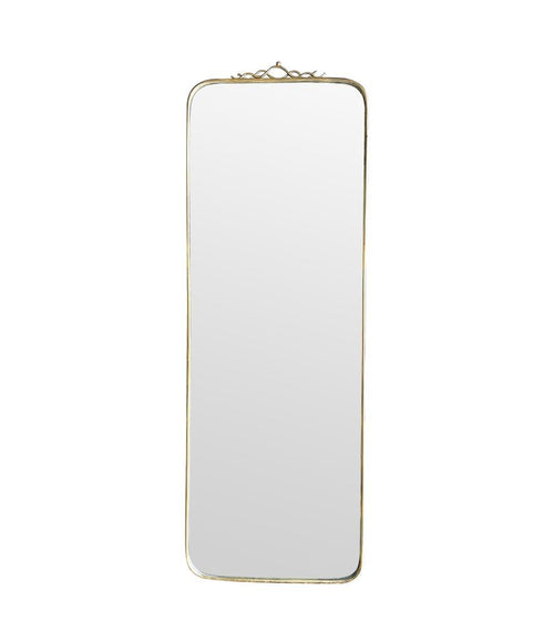 Mid century brass framed mirror with slim profile and scroll top detail