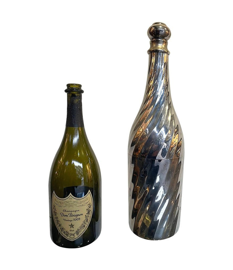 A LARGE 1950S SILVER PLATED CHAMPAGNE BOTTLE COOLER IN THE SHAPE OF A CHAMPAGNE BOTTLE