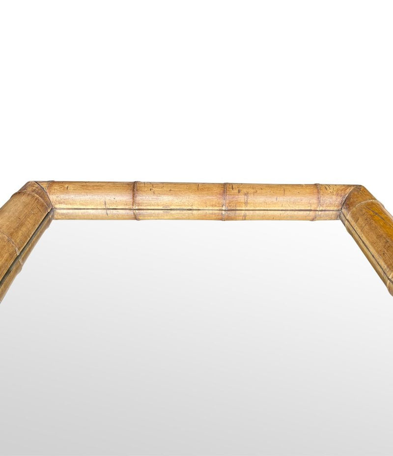 A large square mirror with a thick bamboo frame