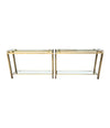1970S GUY LEFEVRE STYLE GILT METAL CONSOLES WITH TWO GLASS SHELVES