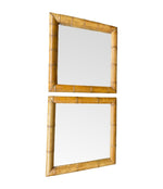 A pair of large square mirrors with thick bamboo frames