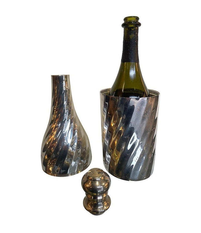 A LARGE 1950S SILVER PLATED CHAMPAGNE BOTTLE COOLER IN THE SHAPE OF A CHAMPAGNE BOTTLE