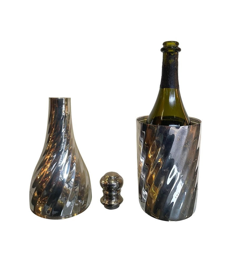 A LARGE 1950S SILVER PLATED CHAMPAGNE BOTTLE COOLER IN THE SHAPE OF A CHAMPAGNE BOTTLE