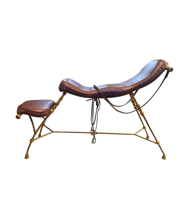 A Mark Brazier Jones "Tally Ho" chair a sculptural chair upholstered in a tan leather, with leather reigns, straps and steel stirrups on a stylised gilt wrought iron frame