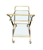 A 1950S BLACK LACQUER AND BRASS BAR CART / TROLLEY BY CESARE LACCA