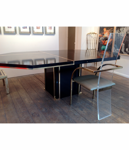 A BLACK MAHEY DINING TABLE