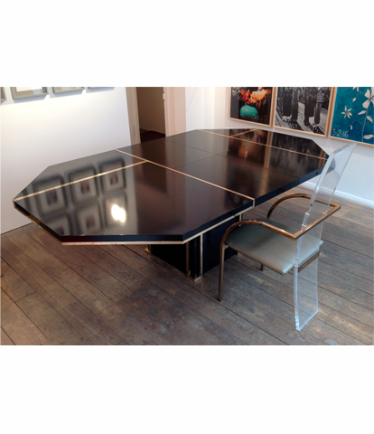 A BLACK MAHEY DINING TABLE