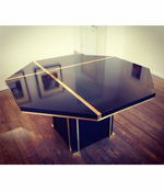 A BLACK MAHEY DINING TABLE