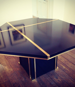 A BLACK MAHEY DINING TABLE