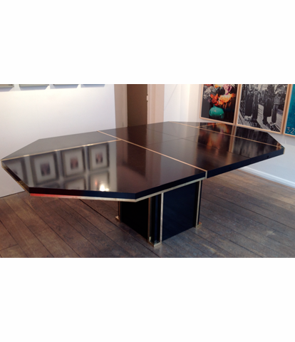 A BLACK MAHEY DINING TABLE