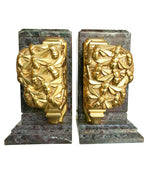 A PAIR OF ART DECO BOOKENDS OF AMAZONITE MARBLE AND CAST GILT METAL BEES