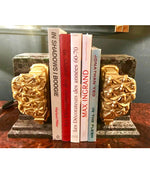 A PAIR OF ART DECO BOOKENDS OF AMAZONITE MARBLE AND CAST GILT METAL BEES