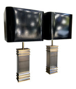 A PAIR OF ART DECO STYLE BRASS LAMPS WITH ORIGINAL SHADES