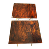 A PAIR OF FAUX TORTOISESHELL SIDE TABLES