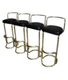 A SET OF FOUR BRASS BAR STOOLS