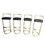 A SET OF FOUR BRASS BAR STOOLS