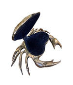 A FONDICA SOLID CAST CRAB WITH HINGED TOP SHELL WITH BLUE VELVET LINING