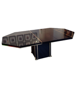 A BLACK MAHEY DINING TABLE