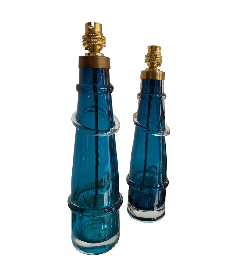 PAIR OF ORREFORS TURQUOISE GLASS LAMPS WITH BRASS FITTINGS AND BESPOKE SHADES