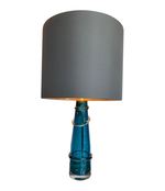 PAIR OF ORREFORS TURQUOISE GLASS LAMPS WITH BRASS FITTINGS AND BESPOKE SHADES