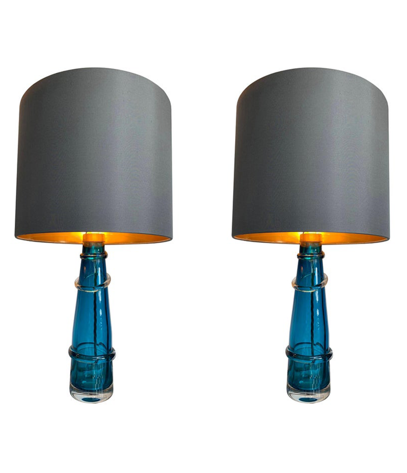 PAIR OF ORREFORS TURQUOISE GLASS LAMPS WITH BRASS FITTINGS AND BESPOKE SHADES